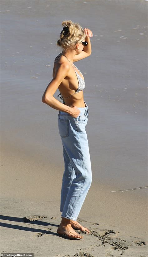 Charlotte Mckinney Flaunts Toned Midriff And Ample Cleavage In Bikini