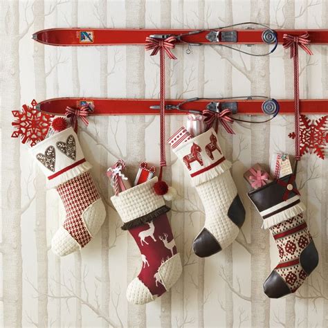 Skis with stockings hung on them. 8 Creative Ways to Hang Stockings Without A Fireplace Mantel