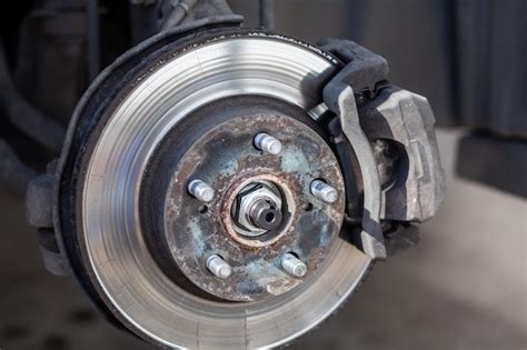 Premium Photo Disc Brake Of The Vehicle For Repair In Process Of Tire