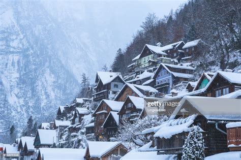Snow Covered Hallstatt Village Along The Lake Before Sunrise Austria