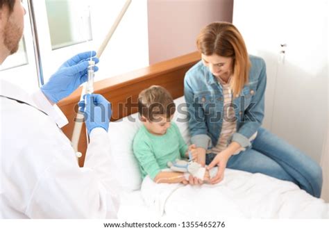 Doctor Adjusting Intravenous Drip Little Child Stock Photo 1355465276