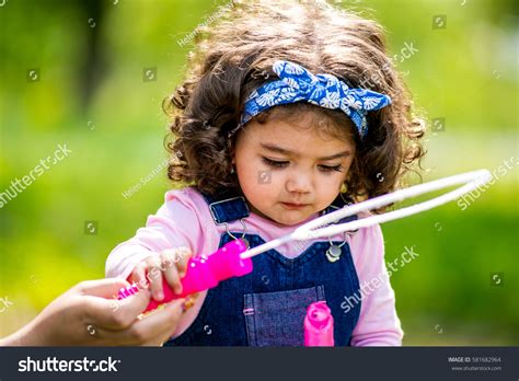 Little Girl Blowing Bubbles Portrait Cute Stock Photo 581682964
