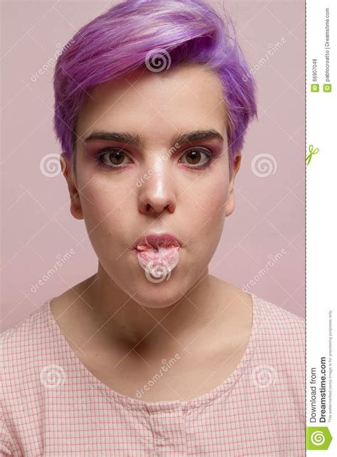 Violet Short Haired Girl In Pink Pastel Making Pink Bubble Gum Stock