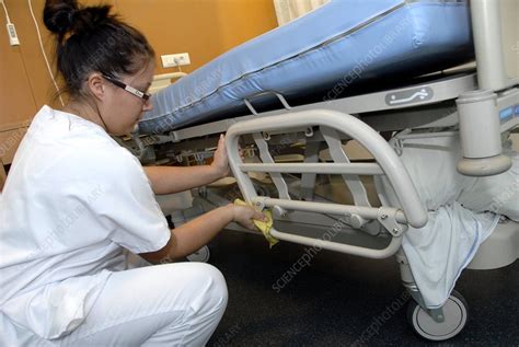 Nurse Cleaning Hospital Bed Stock Image C001 3108 Science Photo Library