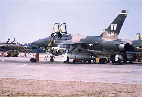 An Air Force Jet Sitting On Top Of An Airport Tarmac Next To Other Planes