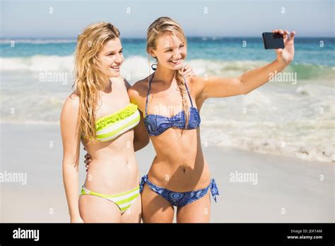 Two Friends In Bikini Taking A Selfie Stock Photo Alamy