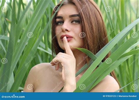beautiful red haired girl is standing in tall grass stock image image of emotion beautiful