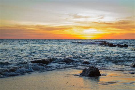 Sunrise Or Sunset Over The Sea View From Tropical Beach With Orange Sky