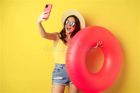 Stylish Brunette Girl On Vacation Taking Selfie With Swim Ring Going On Beach Swimming In Sea