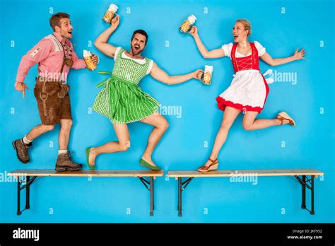 People At The Oktoberfest Dancing On Beer Benches Stock Photo Alamy