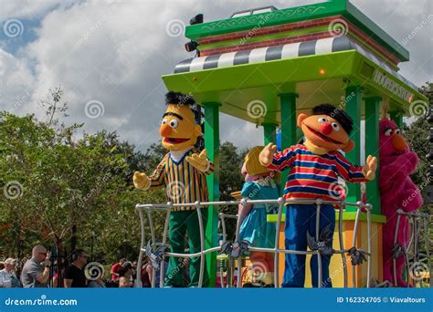 Bert Ernie And Police Woman Dancing In Sesame Street Party Parade At Seaworld Editorial Image