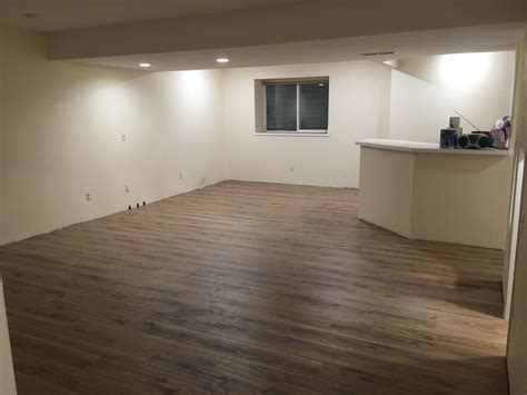 A side by side comparison for painting cabinets: Basement renovation - wood floor laminate from Great ...