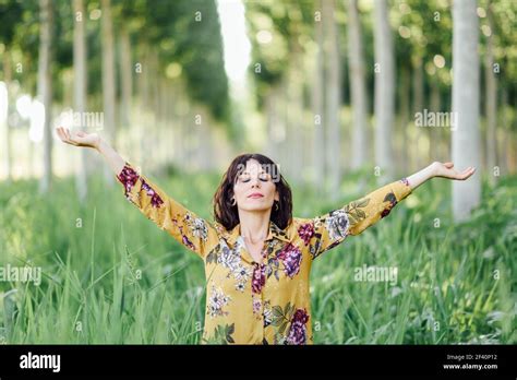 Enjoying The Nature Young Woman Arms Raised Enjoying The Fresh Air In