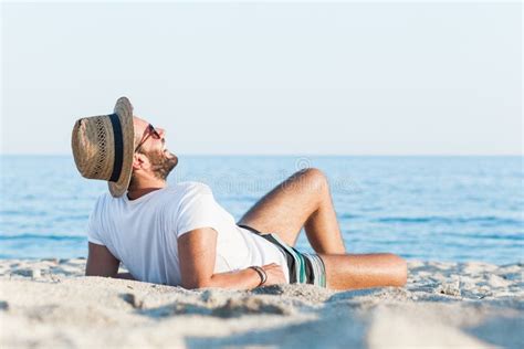 Young Man Lying On The Beach Stock Photo Image Of Chilling Beach