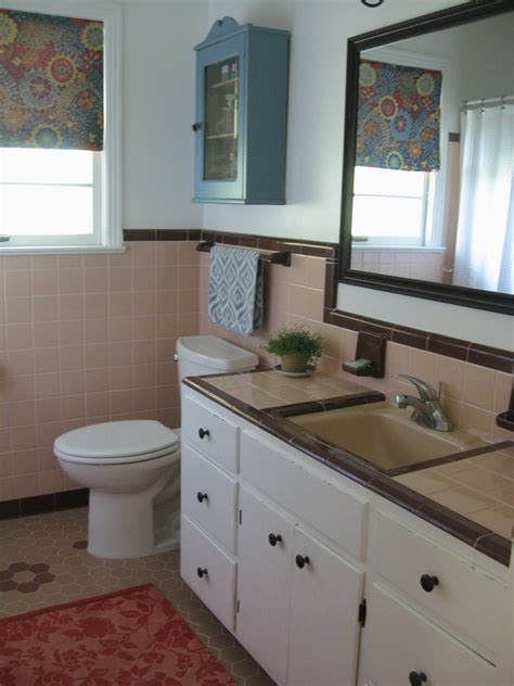 Master bath is tiled in a wonderfully inviting shade of blue. 50s bathroom, peach tile with reddish-brown trim. Blue and ...