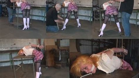 Booted Redhead Cruelly Bound Across A Table Top Hunters Lair Bondage