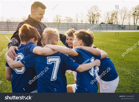 Group Children Soccer Team Celebrating Coach Stock Photo 1394636987
