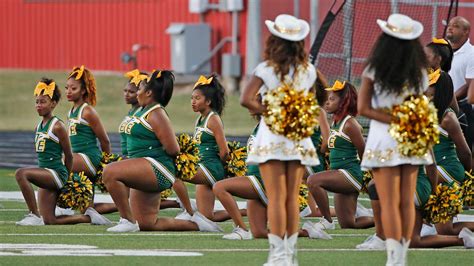 Desoto And Cedar Hill Cheerleaders Kneel During National Anthem Before Game