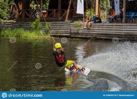 An Athlete Trains And Shows Tricks On The Water While Doing Sports