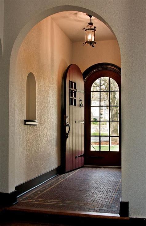 Enhance the beauty of your front entranceenhance the beauty of your front entrance with a distinctive wood entry door. Rounded entryway & door. Reminds me of a Spanish style ...