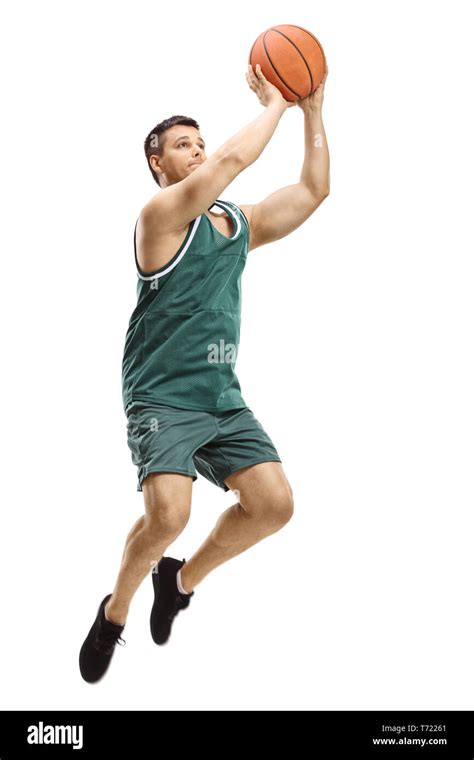 Full Length Shot Of A Male Basketball Player Shooting A Ball Isolated