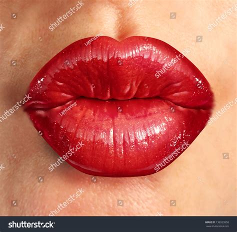 Human Kiss Lips With Glamorous Glossy Red Lipstick On The Face Of An