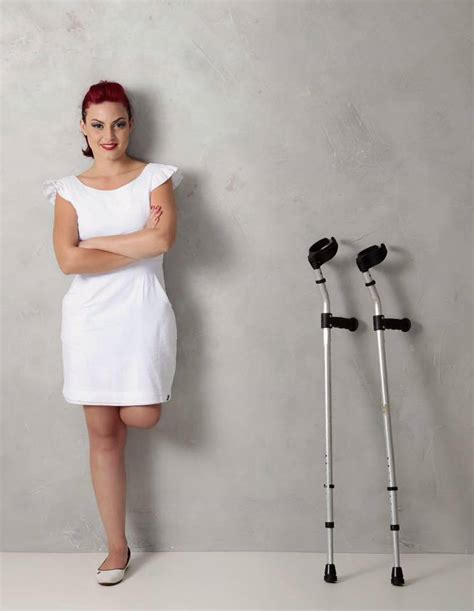 Amputee Woman On Crutches