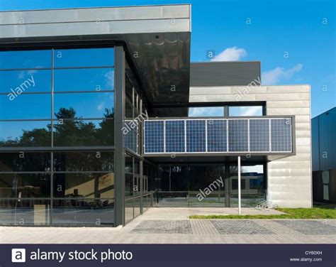 Modern Office Building With Solar Panels Above The Entrance Stock Photo