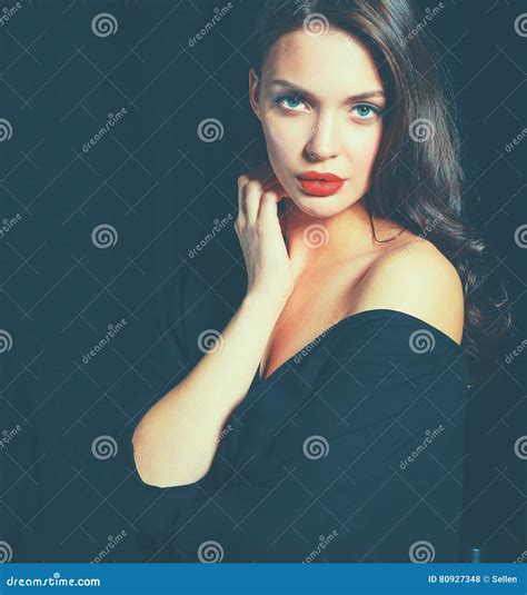 Beautiful Woman Sitting A Chair Isolated On Black Background Stock