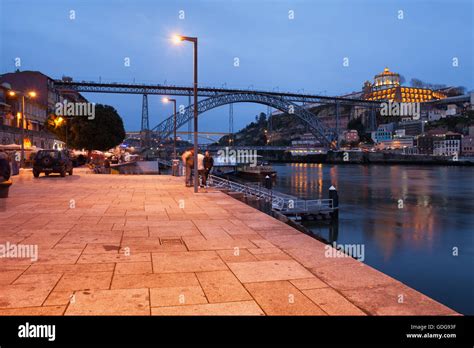 Dom Luis I Bridge Over Douro River And Promenade By Night In Porto And