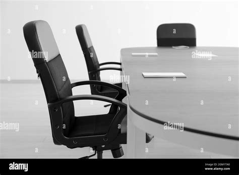Modern Office Interior With Table And Black Armchairs Stock Photo Alamy