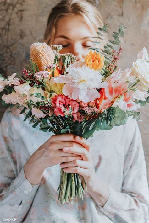 Woman Holding A Bouquet Of Flowers Premium Image