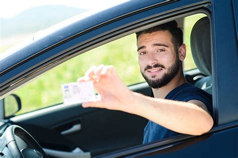 Young Man Holding Driving License Car Stock Photo By ©newafrica