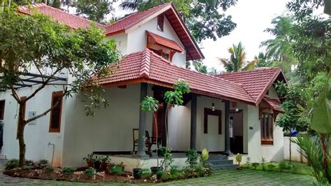 Traditional Kerala Style Residence Designed Around An Existing