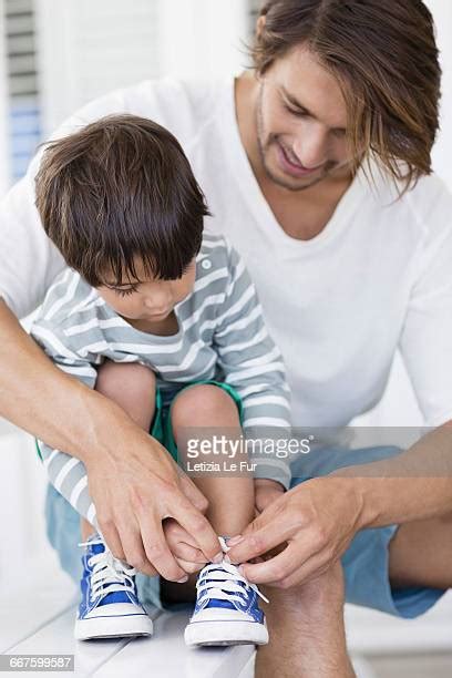 Father Tying Shoe Photos And Premium High Res Pictures Getty Images