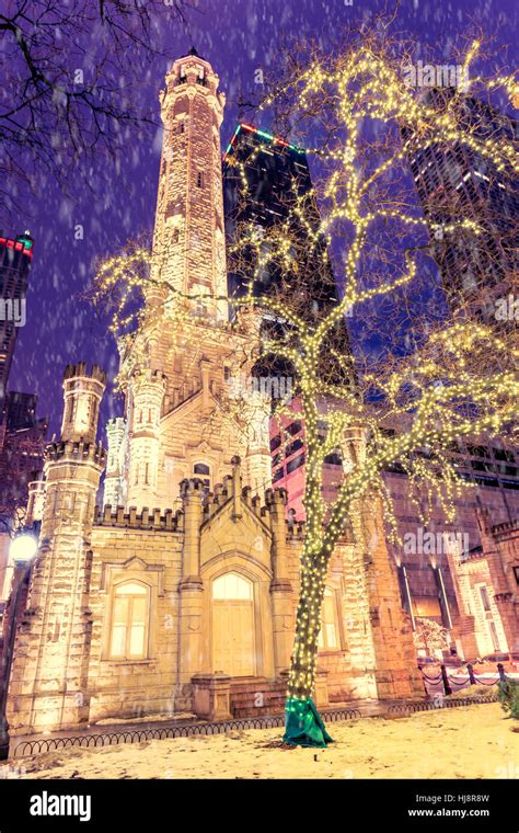 Christmas Lights Illuminating Chicago Water Tower During A Snow Storm