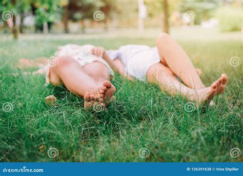Barefoot Woman Laying Grass