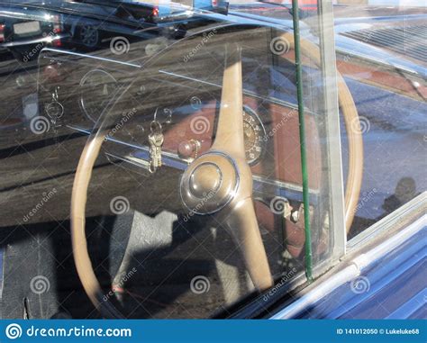 Dashboard Of A Classic Vintage Car With Modern Car Reflections Stock