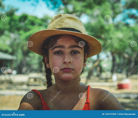 Portrait Of A Little Girl Wearing A Hat Outdoors Stock Image Image Of