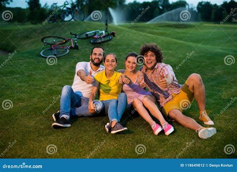 Group Of Friends Gesturing Thumbs Up Outdoors Stock Photo Image Of
