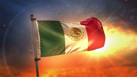 Mexico Flag Fluttering During Sunrise Stock Motion Graphics Motion