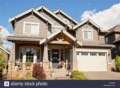 New Beautiful Suburban House With Blue Sky And Clouds Stock Photo