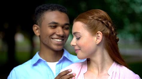 Beautiful Mixed Race Couple Hugging Looking At Each Other Tenderness