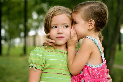 Two Twin Little Sister Girls Whisper In Ear Her Mentor Center