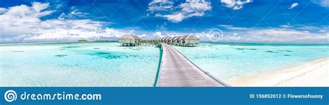 Panorama Of Water Villas Bungalows And Wooden Bridge At Tropical Beach