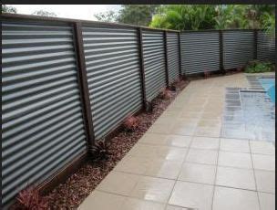 A corrugated metal fence is an affordable option for homeowners, and since it is so easy to install, it's a great diy project. diy screen galvanized metal | corrugated metal fence | Metal fence panels, Corrugated metal ...