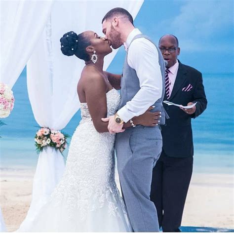 gorgeous interracial couple sharing a kiss on their wedding day if u r looking for serious