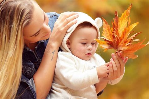 Mother With Son In Autumn Park Stock Image Image Of Game Hands