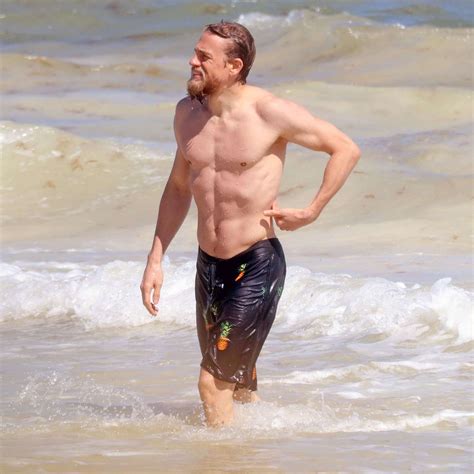 Charlie Hunnam Shows Off Ripped Abs On Beach Vacation With Girlfriend