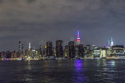 Panoramic View To New York By Night With Hudson River And Illuminated